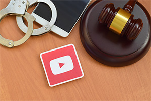 Gavel and handcuffs on a desk